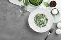 Tasty spinach dip on grey table, flat lay Royalty Free Stock Photo