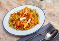 Italian spinach tagliatelle pasta with tomato sauce