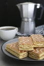 Tasty sponge cakes and hot drink on grey table, closeup Royalty Free Stock Photo