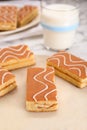 Tasty sponge cakes and milk on white marble table, closeup Royalty Free Stock Photo