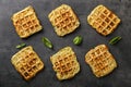 Tasty squash waffles on grey background, top view