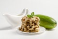 Tasty squash waffles with sour cream and zucchini on white background