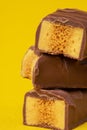 Tasty Stacked Chocolate Honeycomb Treat on yellow background