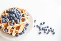 Tasty stacked waffles with blueberries