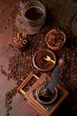 Tasty steaming espresso in cup with coffee beans. View from above. Dark background