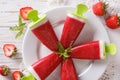 Tasty strawberry popsicle on a stick close-up. horizontal top vi