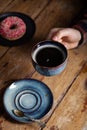 Tasty Strawberry Sprinkled Donut, Vintage Tea Spoon, Black Americano Coffee In Blue Cup In Male Hand. Concept Breakfast In Coffee