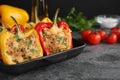 Tasty stuffed bell peppers in baking pan on table, closeup Royalty Free Stock Photo