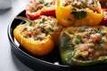 Tasty stuffed bell peppers on table, closeup