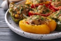Tasty stuffed bell peppers on grey wooden table, closeup Royalty Free Stock Photo