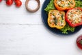 Tasty stuffed bell peppers served on white wooden table, flat lay. Space for text Royalty Free Stock Photo