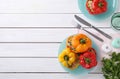 Tasty stuffed bell peppers served on white wooden table, space for text Royalty Free Stock Photo