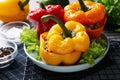 Tasty stuffed bell peppers on table