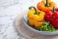 Tasty stuffed bell peppers on white marble table Royalty Free Stock Photo