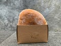 Tasty sugared doughnut in a simple takeaway box Royalty Free Stock Photo