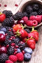 Tasty summer fruits on a wooden table