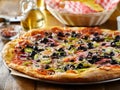 Tasty supreme pizza with olives peppers onions and sausage Royalty Free Stock Photo