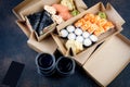 Tasty sushi rolls in disposable kraft paper boxes, sauces, chopsticks. Food for take away or delivery