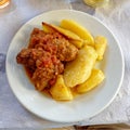 Tasty `sutzoukia` meat balls with potatoes, traditional Greek plate