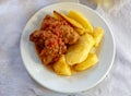 A tasty `sutzoukia` meat balls served with potatoes, traditional Greek plate.