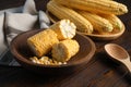 Tasty sweet corn cobs on wooden table Royalty Free Stock Photo