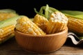 Tasty sweet corn cobs on wooden table, closeup Royalty Free Stock Photo