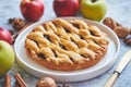 Tasty sweet homemade apple pie cake with cinnamon sticks, walnuts and apples Royalty Free Stock Photo