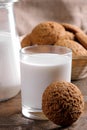 Tasty sweet oatmeal cookies with milk on a brown wooden table. close-up Royalty Free Stock Photo