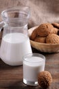 Tasty sweet oatmeal cookies with milk on a brown wooden table Royalty Free Stock Photo