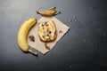 Tasty sweet sandwiches with bananas, nuts and chocolate, on bla