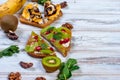 Tasty sweet sandwiches with bananas, nuts and chocolate, kiwi, s