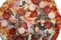 tasty takeaway pizza with spicy salami wurstel mushrooms and ham Royalty Free Stock Photo
