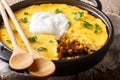Tasty Tamale pie with corn and ground beef and cheese closeup in a pan. horizontal