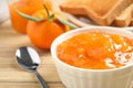 Tasty tangerine jam in bowl on wooden table  closeup Royalty Free Stock Photo