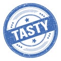 TASTY text on blue round grungy stamp Royalty Free Stock Photo