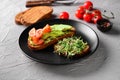 Tasty toasts with avocado on plate