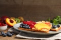 Tasty toasts with different spreads and fruits on wooden table Royalty Free Stock Photo