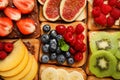 Tasty toasts with different spreads and fruits on wooden table, flat lay Royalty Free Stock Photo