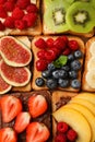 Tasty toasts with different spreads and fruits on wooden table, flat lay Royalty Free Stock Photo