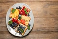 Tasty toasts with different spreads and fruits on wooden table, top view. Space for text Royalty Free Stock Photo