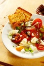 Tasty tomato and cheese salad with herbs Royalty Free Stock Photo