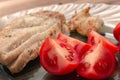 Tasty tomatoes pieces served with fish