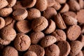 A tasty topdown portrait of a pile of delicious traditional dutch snacks called pepernoten or pepernuts. The gingerbread treat is