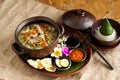 Tasty traditional dishes call soto betawi in brown bowl