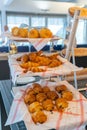 Tasty traditional European pastry on decorated shelf at bakery Royalty Free Stock Photo