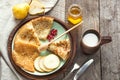 Tasty traditional russian breakfast of slapjack with honey on plate. Rustic style. Space for your text. Royalty Free Stock Photo