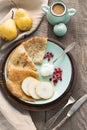 Tasty traditional russian breakfast of slapjack with honey on plate. Rustic style. Space for your text. Royalty Free Stock Photo