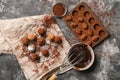Tasty truffles with melted chocolate on grey table Royalty Free Stock Photo
