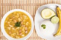 Tasty typical Colombian food; Mondongo of soup with avocado, banana and white rice Royalty Free Stock Photo