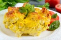 Tasty useful casserole from cauliflower on a plate on a dark wooden background.